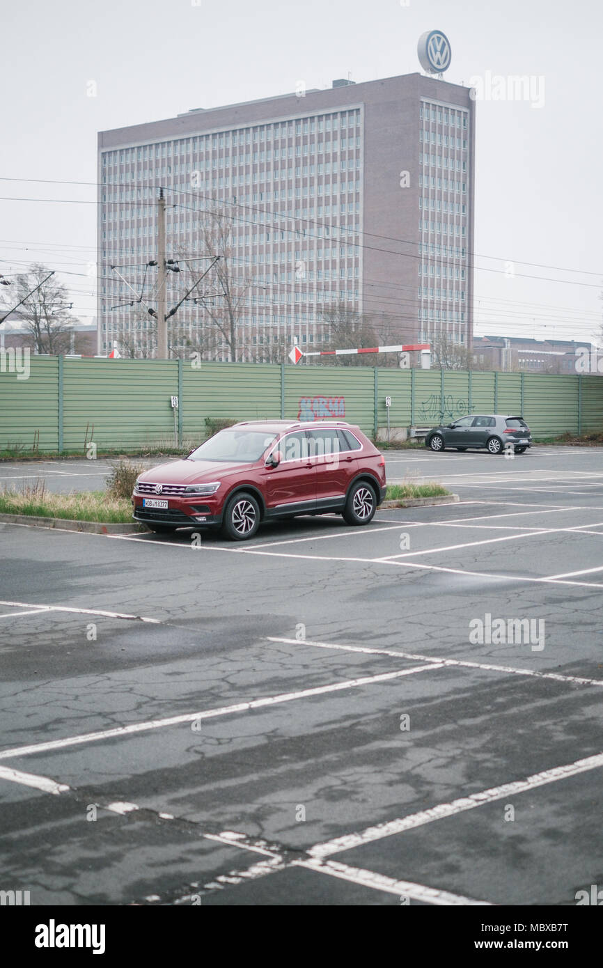12 April 2018, Germany, Wolfsburg: A car of the model Volkswagen Tiguan stands on the parking lot of a Volkswagen manufacturing facility. The board of the car company will discuss its upcoming restructuring. Photo: Ole Spata/dpa Stock Photo