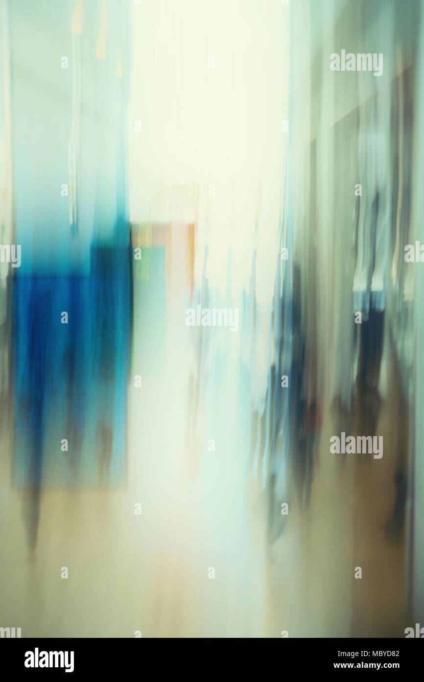 Abstract image of people walking  in building lobby Stock Photo