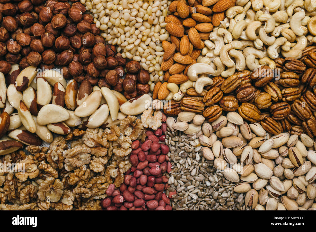 Nuts mix in a canvas bag in table. Kinds of nuts pecan, brazil, cedar