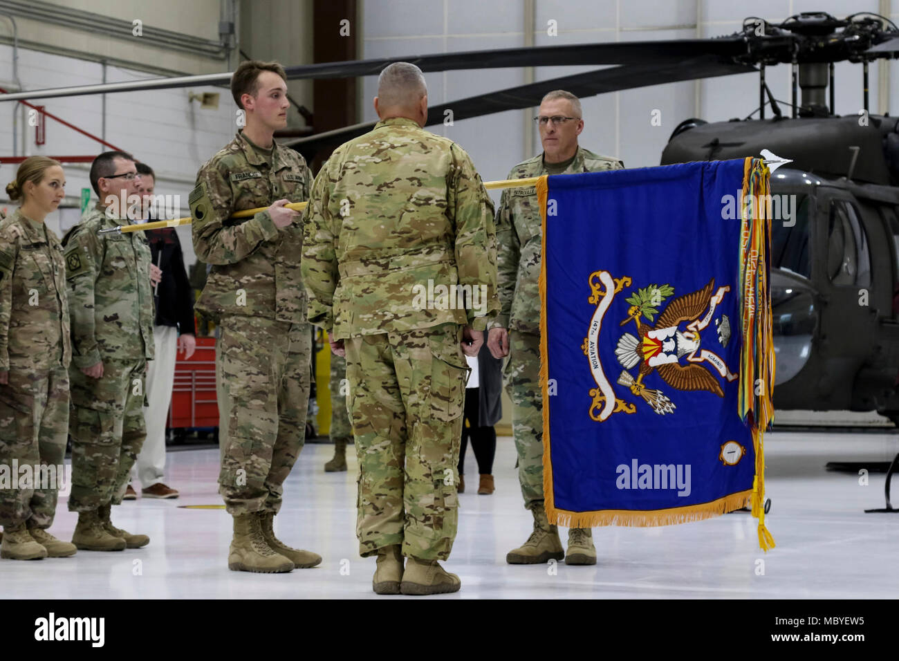 Lt. Col. Scott Bush and Command Sgt. Maj. Curtis Patrouille uncase the battalion colors for the Wisconsin Army National Guard’s 1st Battalion, 147th Aviation during a welcome-home ceremony Jan. 25 after a nine-month Middle East deployment. The unit provided UH-60M Black Hawk helicopter airlift assets and maintenance support personnel, flew 3,700 mission hours, conducted 69 medical evacuations, and transported more than 5,900 troops as well as approximately 200,000 pounds of cargo. Wisconsin National Guard Stock Photo