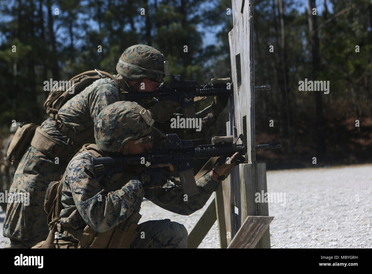 U.S. Marines with 2nd Marine Division, rehearse static firing techniques during a range as part of a close quarter’s tactics enabler’s course at Camp Lejeune, N.C., March 23, 2018. The course provided Marines the opportunity to improve fire and movement tactics as a security platoon element. Marines participated in the training in preparation for their upcoming deployment with 22ndnMarine Expeditionary Unit. Stock Photo