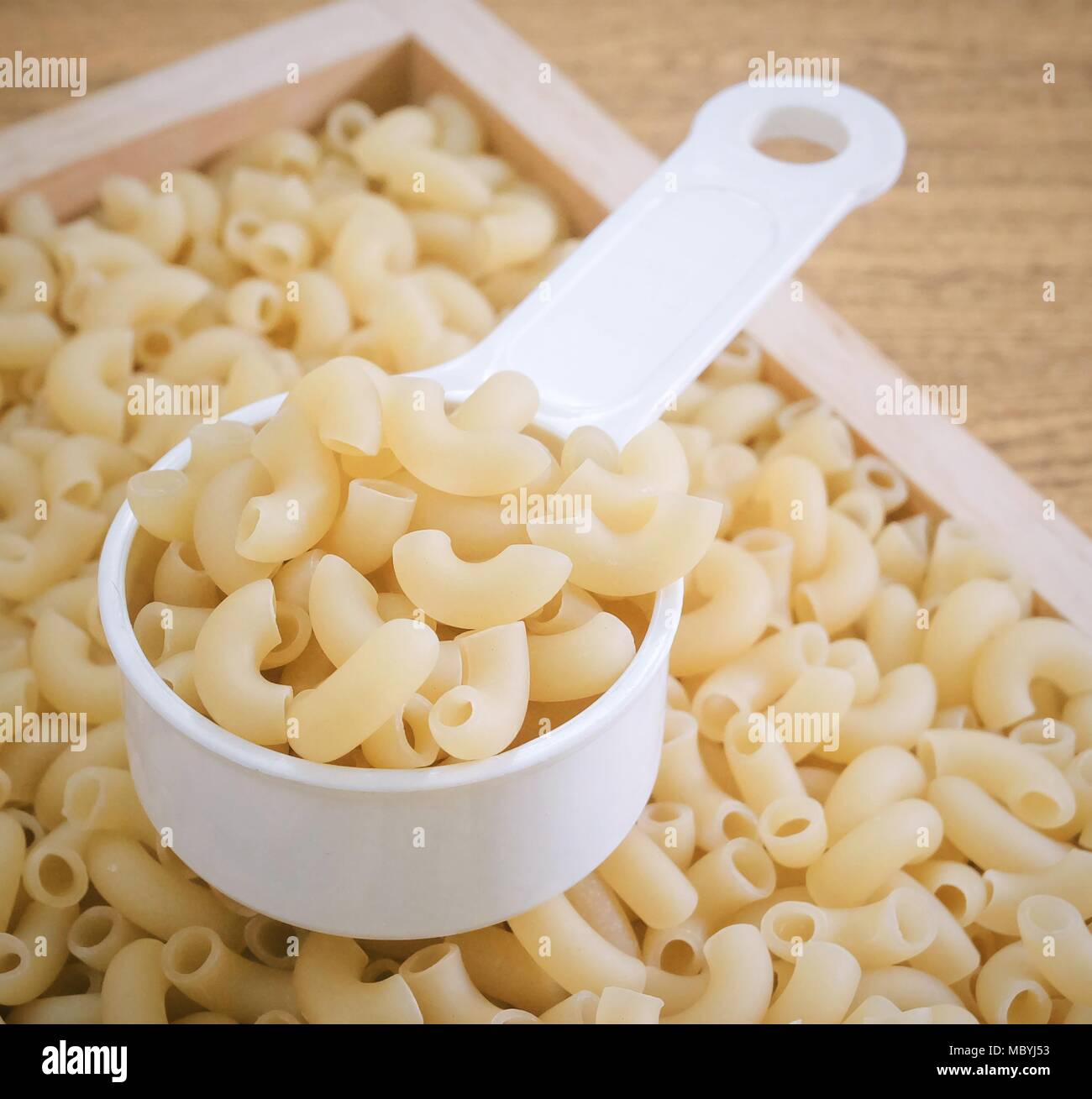 Food and Cuisine, Uncooked and Dried Elbow Macaroni or Gomiti Pasta in