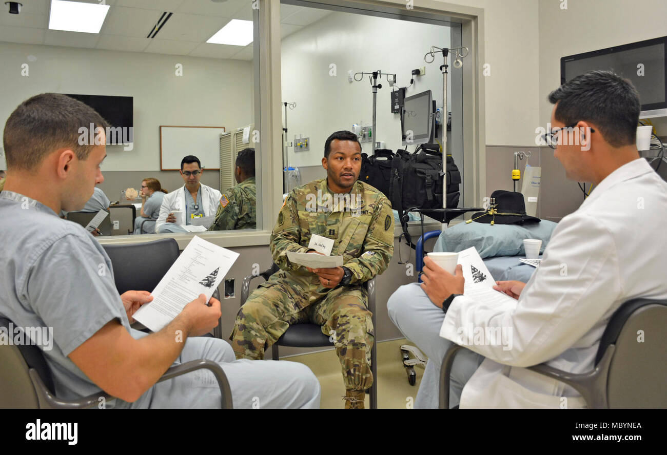 Capt. McHuy McCoy, (center), staff physician at Tripler Army Medical ...