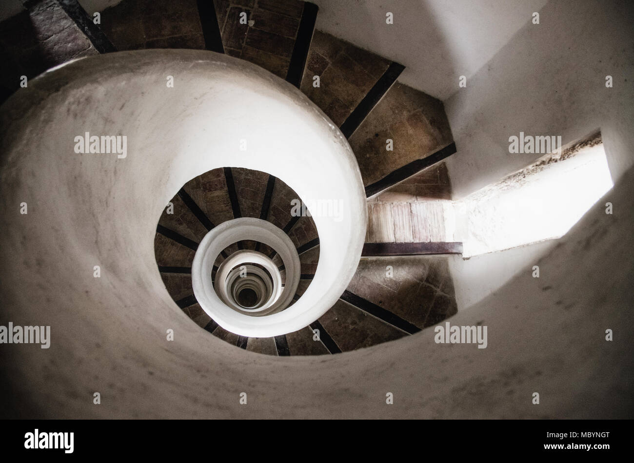 Spiral stone staircase in tower of old church in Valencia, Spain Stock Photo