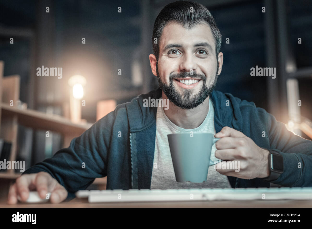 Happy IT guy studying programming language Stock Photo - Alamy