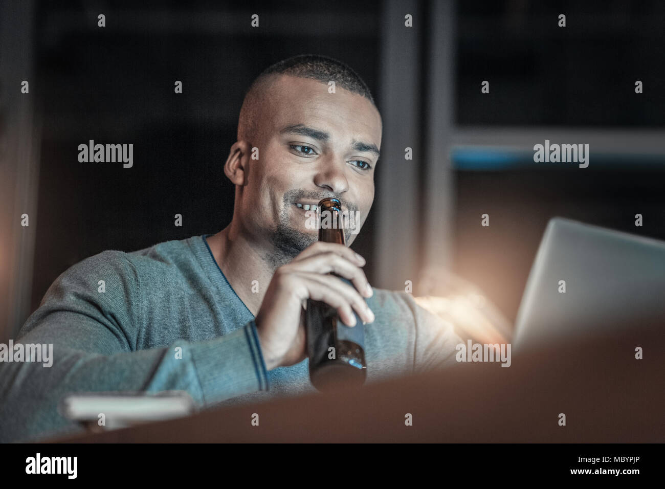 Smart IT guy creating programming language Stock Photo - Alamy
