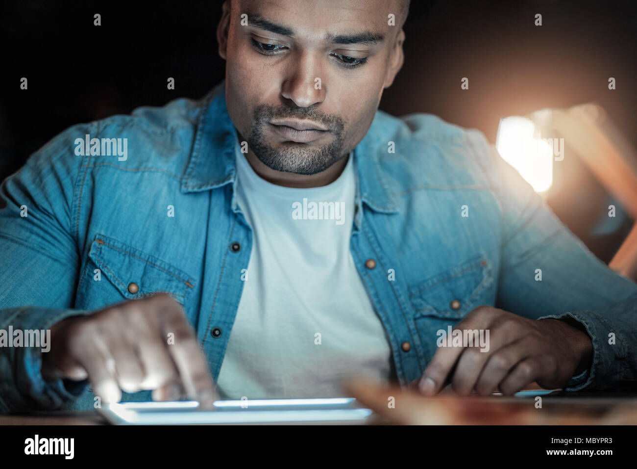 Earnest IT guy testing speed Stock Photo