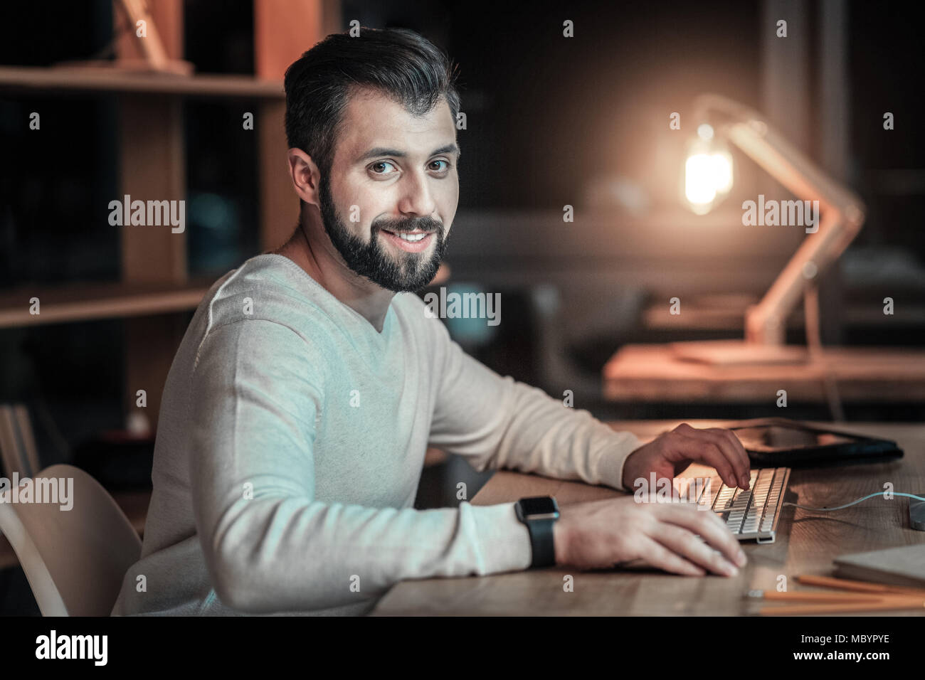 Young man programmer writing code hi-res stock photography and images ...