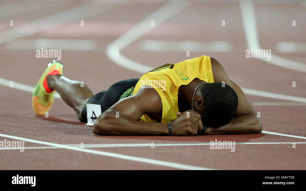 Jamaica's Andre Clarke lies on the track in the Men's 400m Hurdles