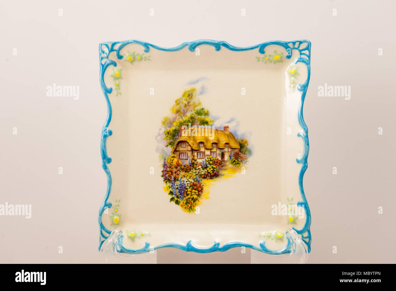 a hand crafted square decorative plate with scalloped edge Stock Photo