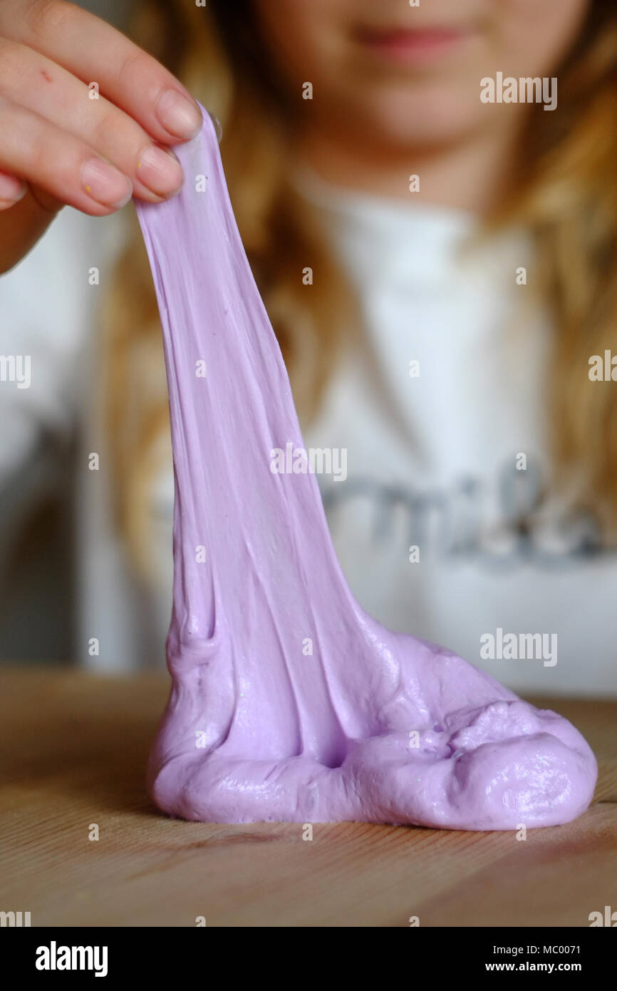 Child with home made slime. The new craze uses borax and PVA glue and