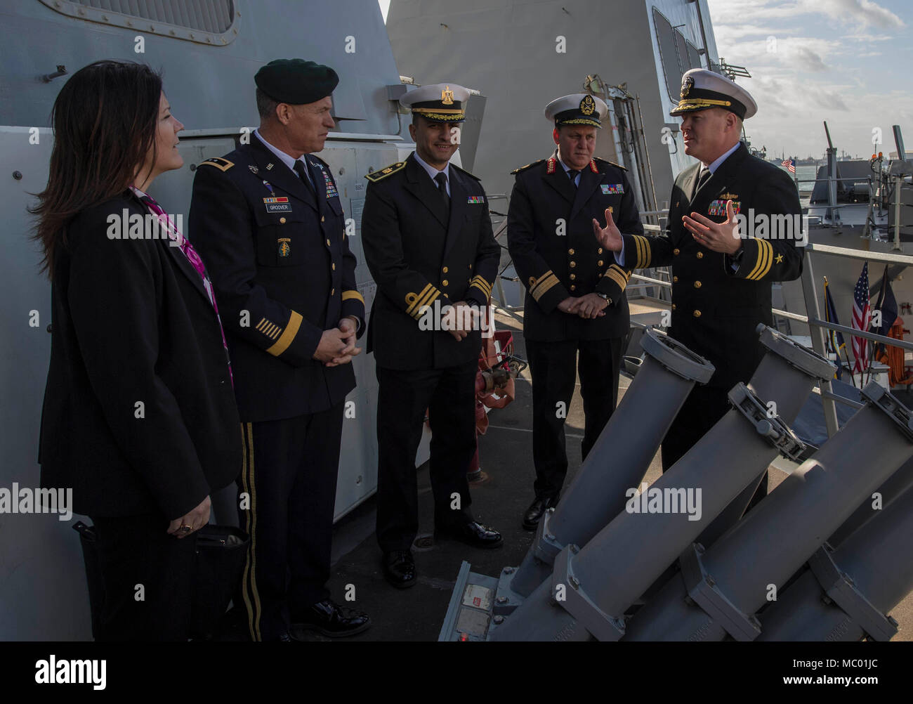 180117-N-KA046-0240 ALEXANDRIA, Egypt (Jan. 17, 2017) Cmdr. Peter Halvorsen, right, commanding officer of the Arleigh Burke-class guided-missile destroyer USS Carney (DDG 64) gives a ship's tour to U.S. Embassy Cairo Deputy Chief of Mission Dorothy Shea , U.S. Army Major General Ralph Groover, second from left, defense attaché and Egyptian Navy Rear Adm. Ehab Mohamed Sobhy, second from right, commander of Alexandria Naval Base, during a scheduled port visit in Alexandria, Egypt. Carney, forward-deployed to Rota, is on its fourth patrol in the U.S. 5th Fleet area of operations in support of mar Stock Photo