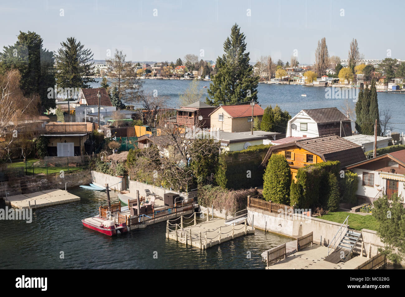Small houses with garden on old Danube river in Vienna Austria, April