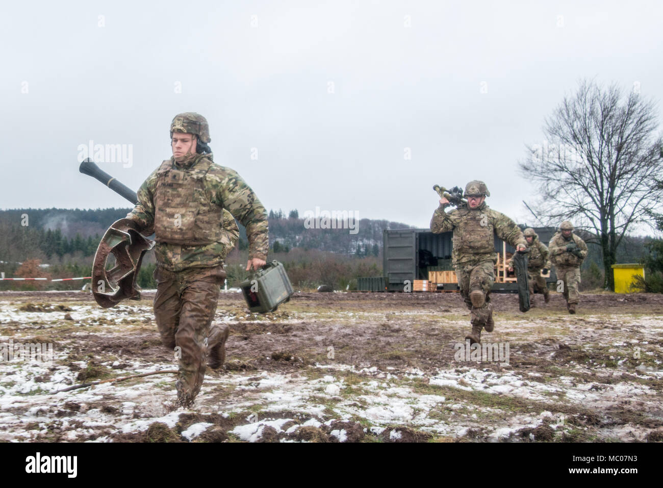 U.S. Soldiers assigned to Headquarters and Headquarters Company, 1st Battalion, 503rd Infantry Regiment, 173rd Infantry Brigade Combat Team (Airborne), fire the M252A1 81mm Mortar System at Mortar Firing Point 1 in the Baumholder Military Training Area, Germany, Jan. 18, 2018. The training provided the Mortarmen the opportunity to increase their proficiency and familiarization with the weapon system. The 173rd Airborne Brigade is the U.S. Army’s Contingency Response Force in Europe, providing rapidly deploying forces to the U.S. Army Europe, Africa and Central Command Areas' of Responsibility  Stock Photo