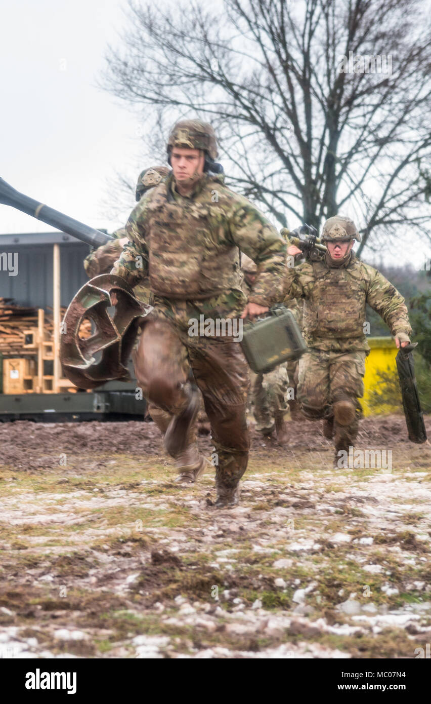 U.S. Soldiers assigned to Headquarters and Headquarters Company, 1st Battalion, 503rd Infantry Regiment, 173rd Infantry Brigade Combat Team (Airborne), fire the M252A1 81mm Mortar System at Mortar Firing Point 1 in the Baumholder Military Training Area, Germany, Jan. 18, 2018. The training provided the Mortarmen the opportunity to increase their proficiency and familiarization with the weapon system. The 173rd Airborne Brigade is the U.S. Army’s Contingency Response Force in Europe, providing rapidly deploying forces to the U.S. Army Europe, Africa and Central Command Areas' of Responsibility  Stock Photo