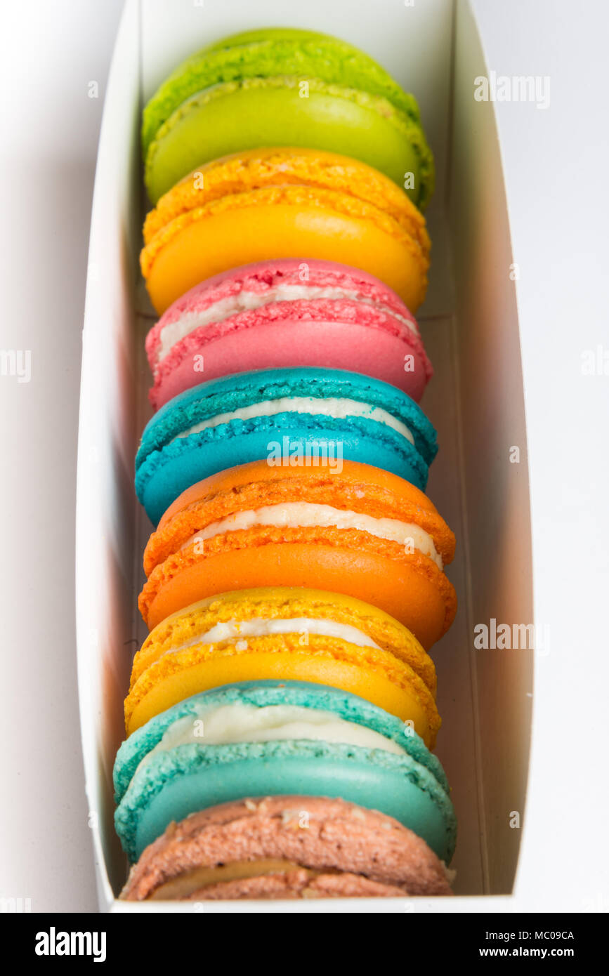 Close up of a box full of colorful macaroons. Stock Photo