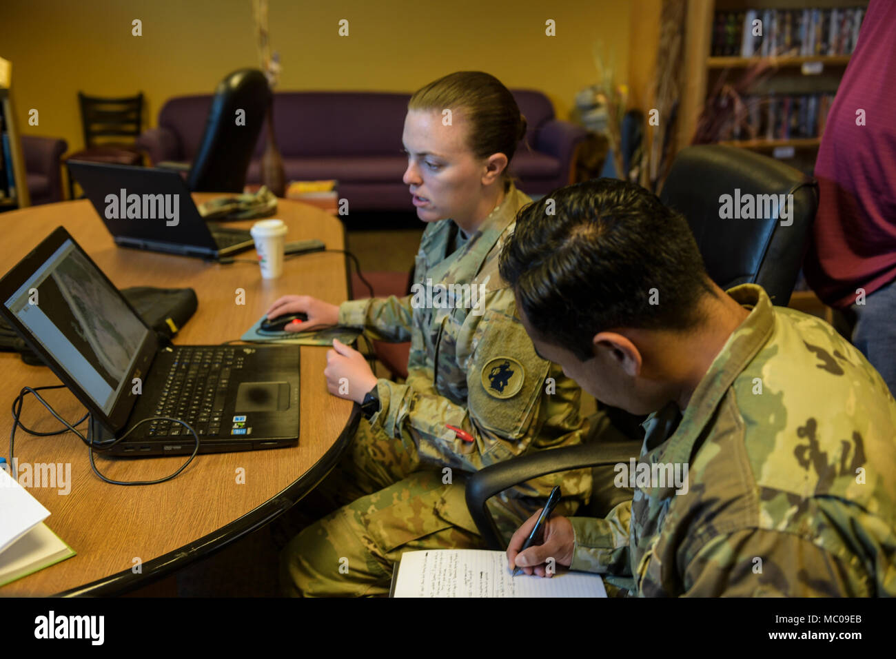 U.S. Army 1st Lt. Marie Adams and  1st Lt. Jose Rivas, engineer project officers with Joint Task Force-Bravo, monitor collected information using drone software after completing a trining exercise at Soto Cano Air Base and the Honduran 1st Engineer Battalion at Siguatepeque, Honduras, Jan. 12, 2018.  The course integrated the JTF-Bravo engineer staff and their Honduran counterparts to learn how to use a professional mapping drone by capturing high-resolution aerial photos and transforming them in to three dimensional models. (U.S. Army photo by Maria Pinel) Stock Photo