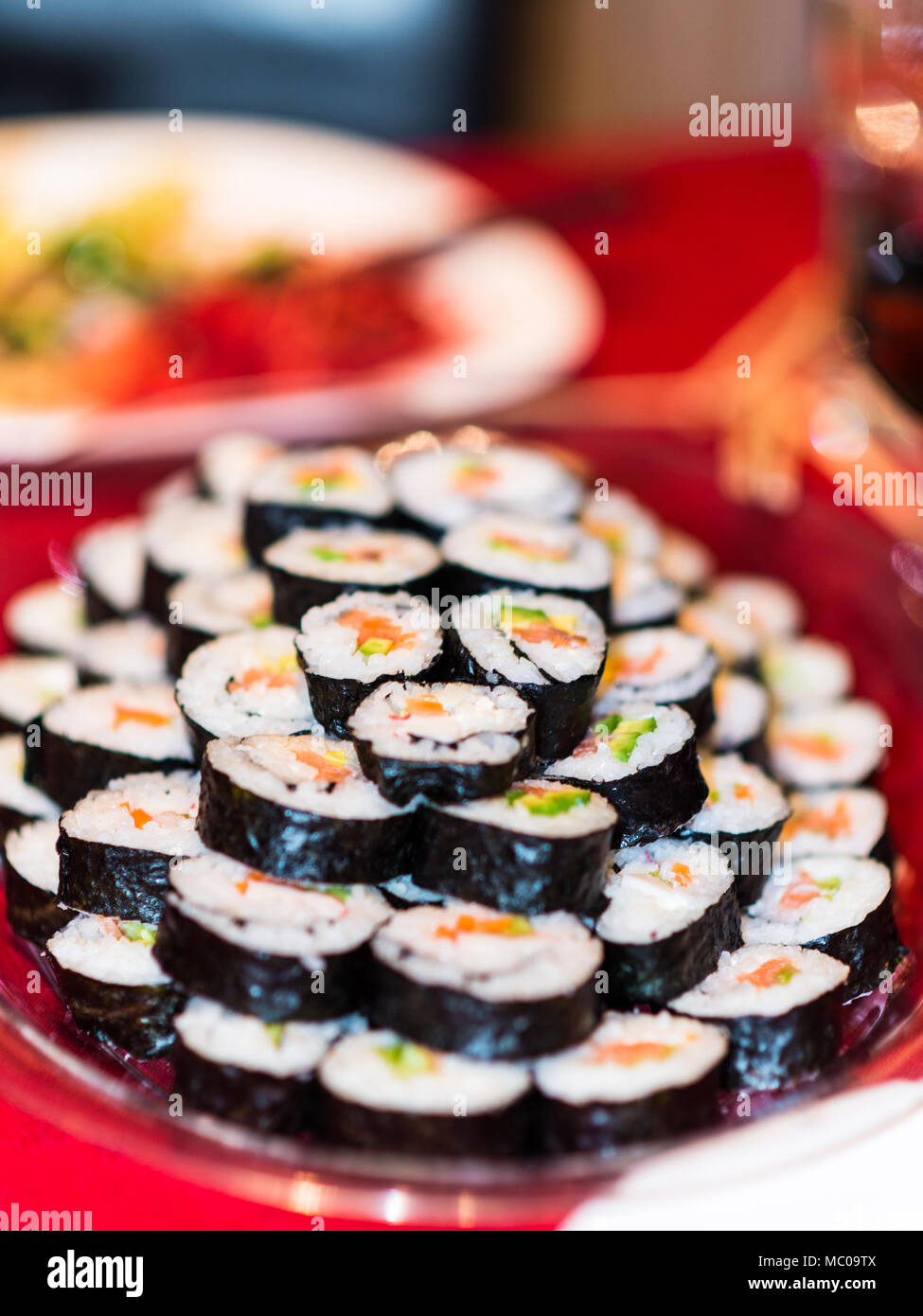 Close up of a plate full of sushi rolls. Stock Photo