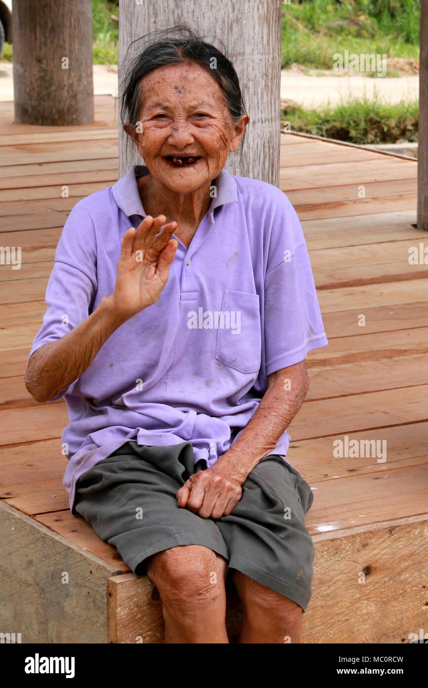 An old Toraja Grandma smiling edentulously into the Camera Stock Photo