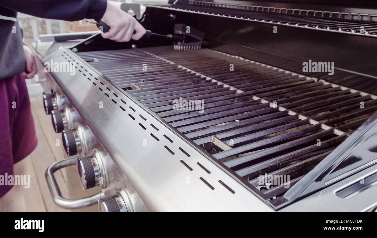 Cleaning gas grill before cooking Stock Photo Alamy