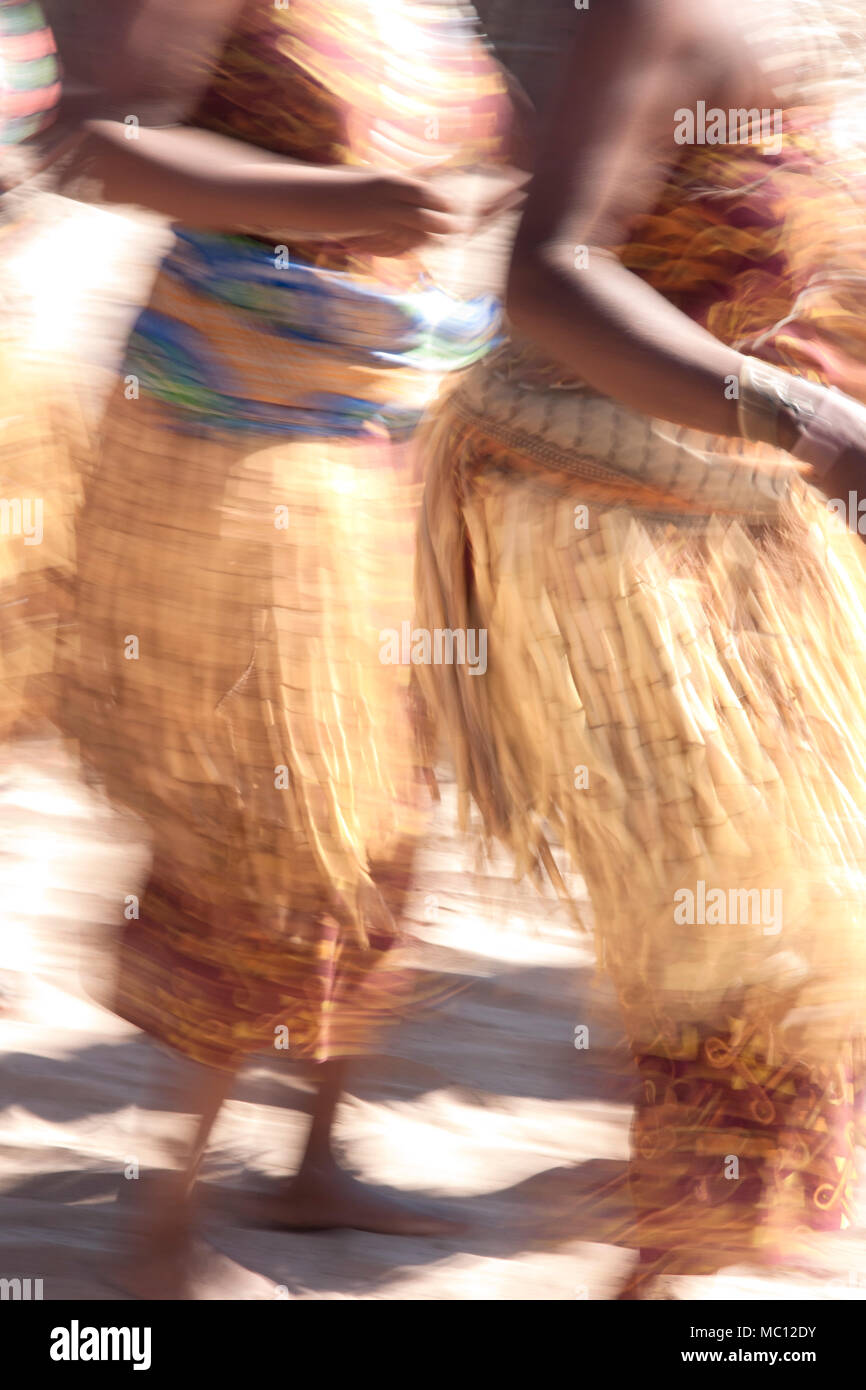 Villagers dancing in motion, Kxoe village, Kwando river area, Caprivi Strip, eastern Namibia, Africa Stock Photo
