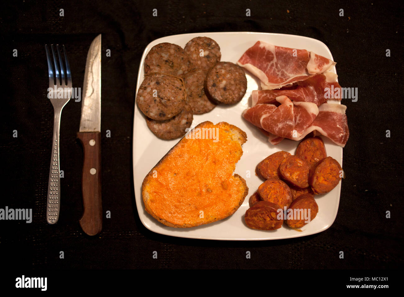 Sausage (chorizo), salami (salchichon), blood sausage (morcilla) and a