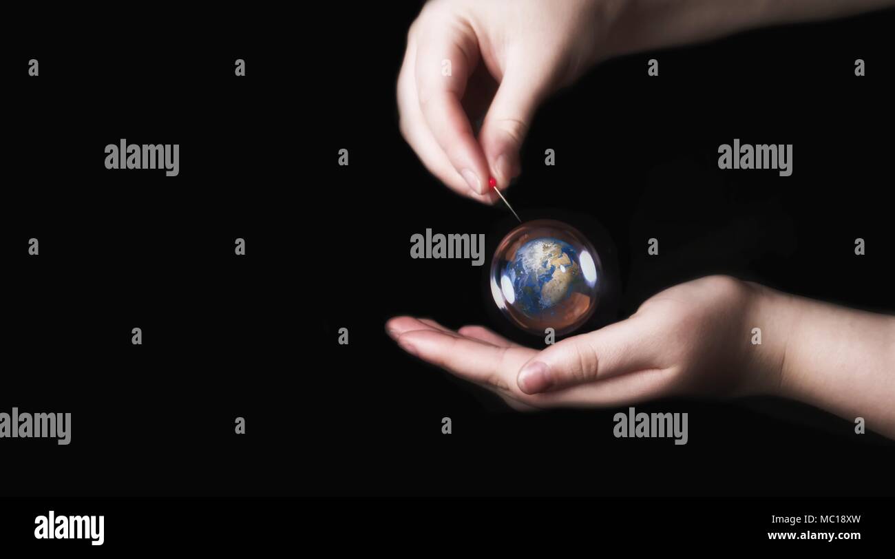 Earth in a soap bubble with black background, Environment Conservative concept Stock Photo
