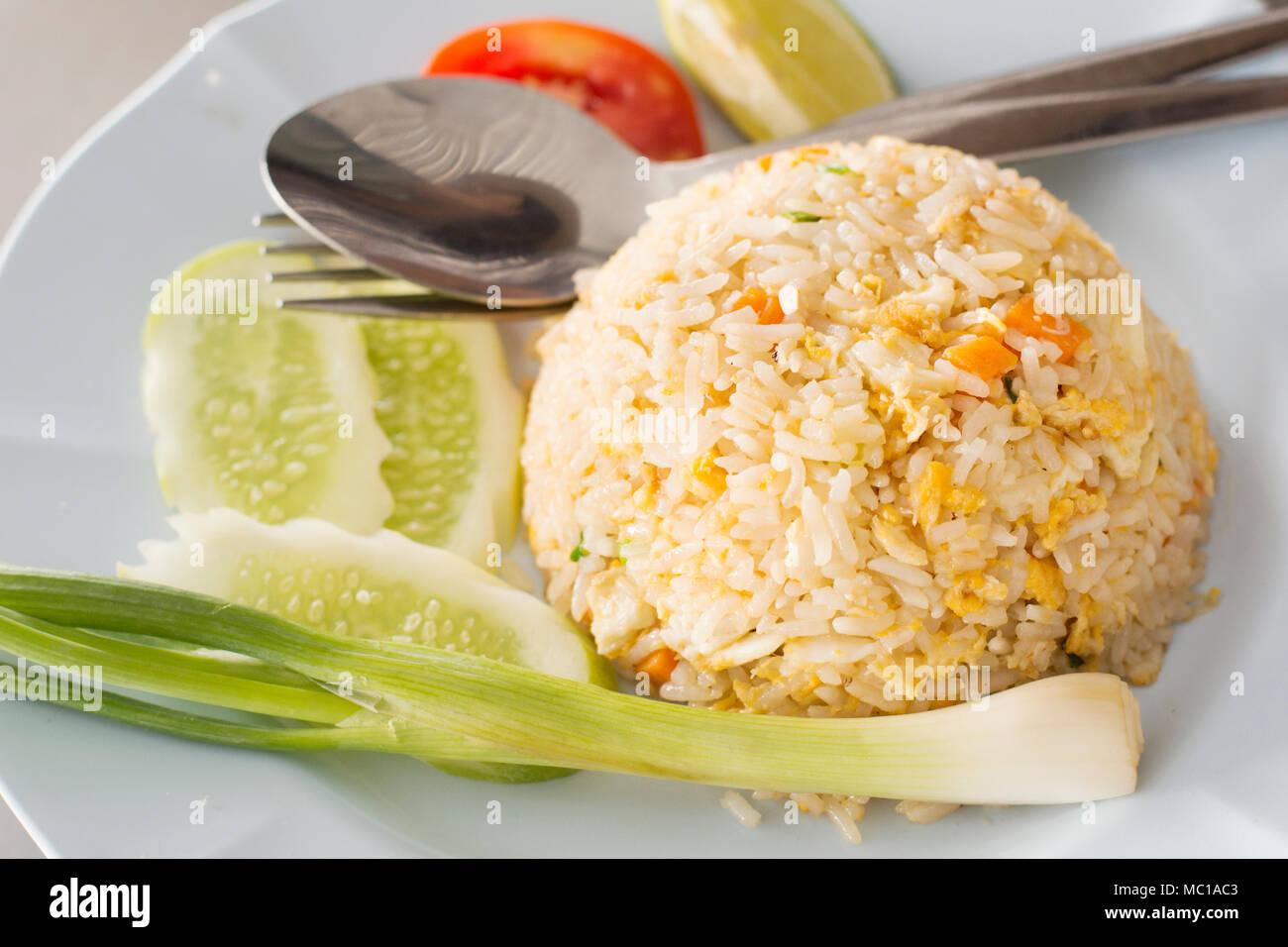 Thai fried rice with crab meat served with vegetable at seafood