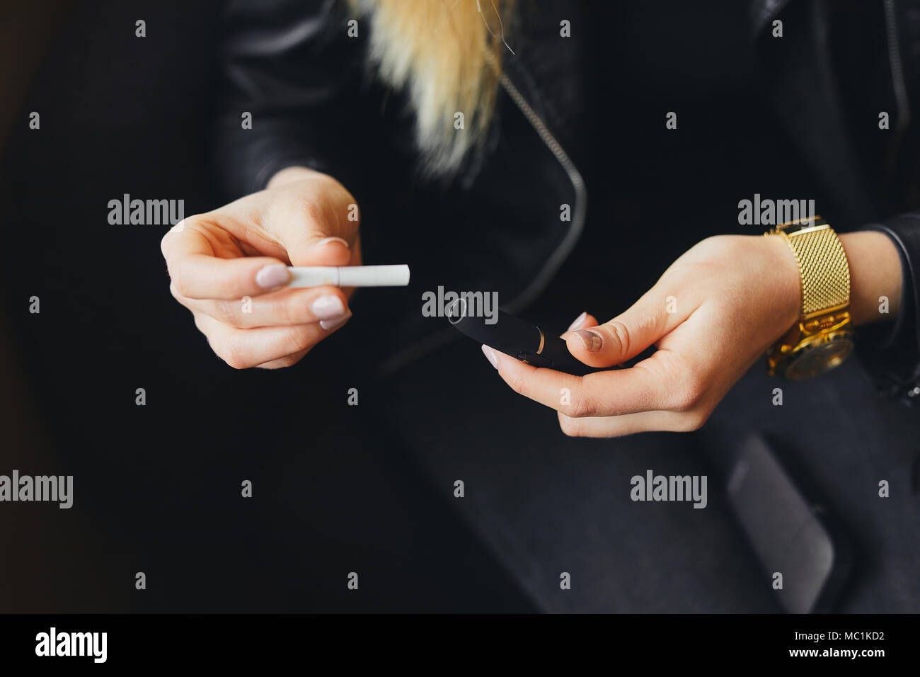 Close up electronic cigarette with case and blur girl on background Stock  Photo - Alamy