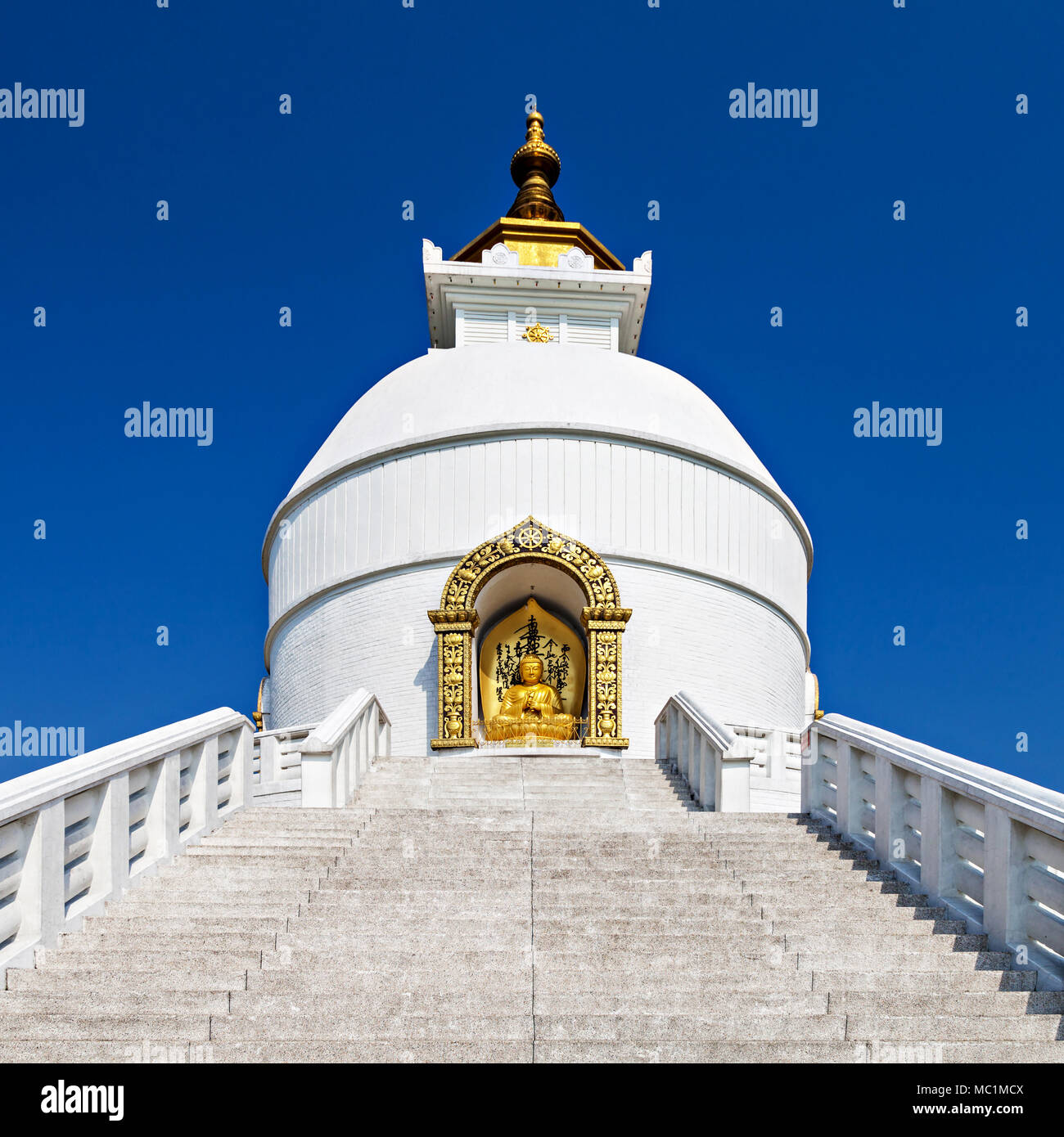 POKHARA, NEPAL - MAY 12: World Peace Pagoda on May 12, 2012, Pokhara, Nepal. For unite people their search for world peace. Most pagodas built since W Stock Photo