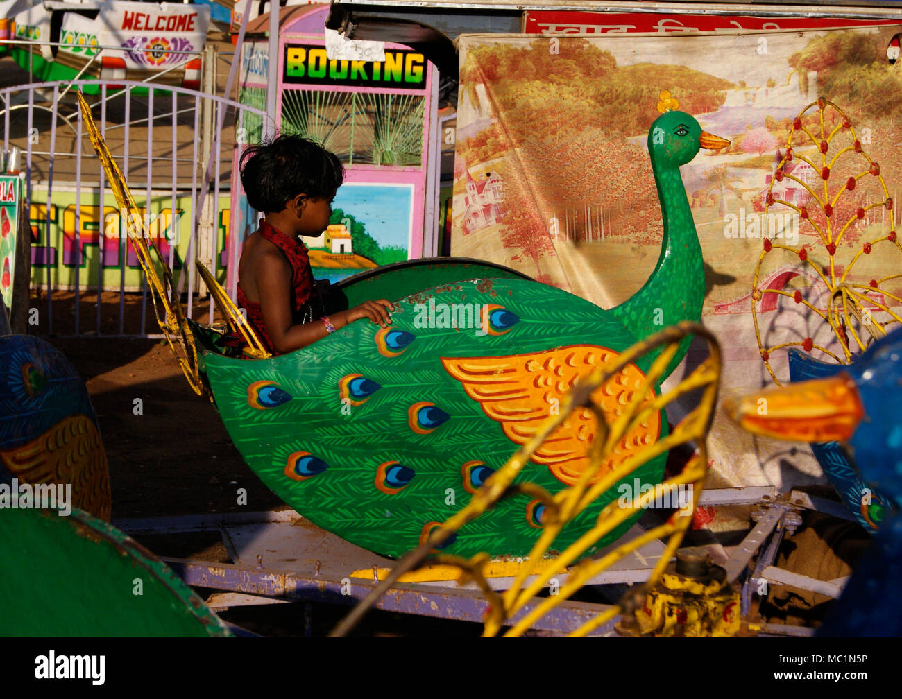 Indian Girl Child enjoying peacock ride in Children's Park Odisha India Stock Photo