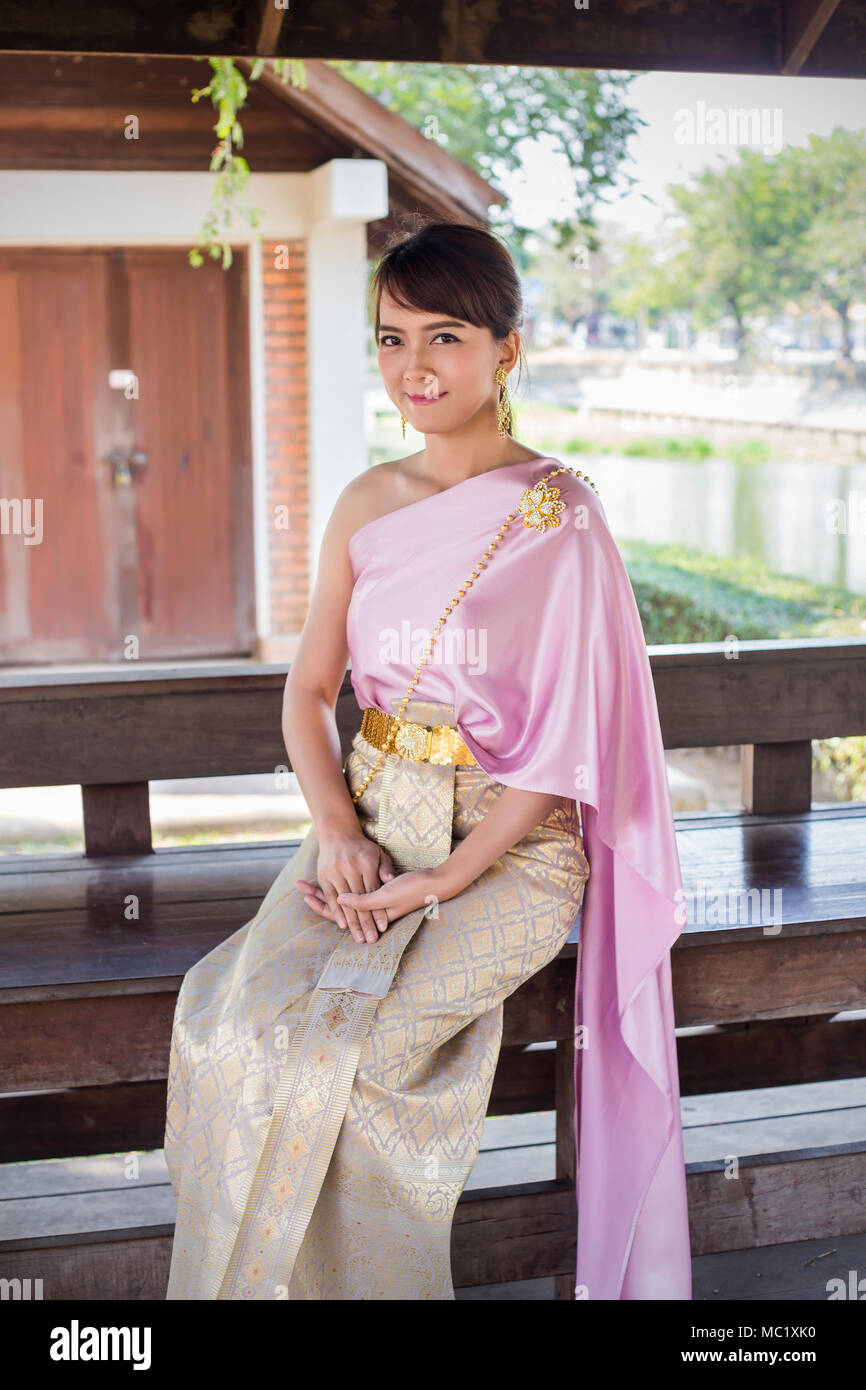 Women sit wearing traditional cloth Thailand or Thai dress in traditional  Thai House Stock Photo - Alamy