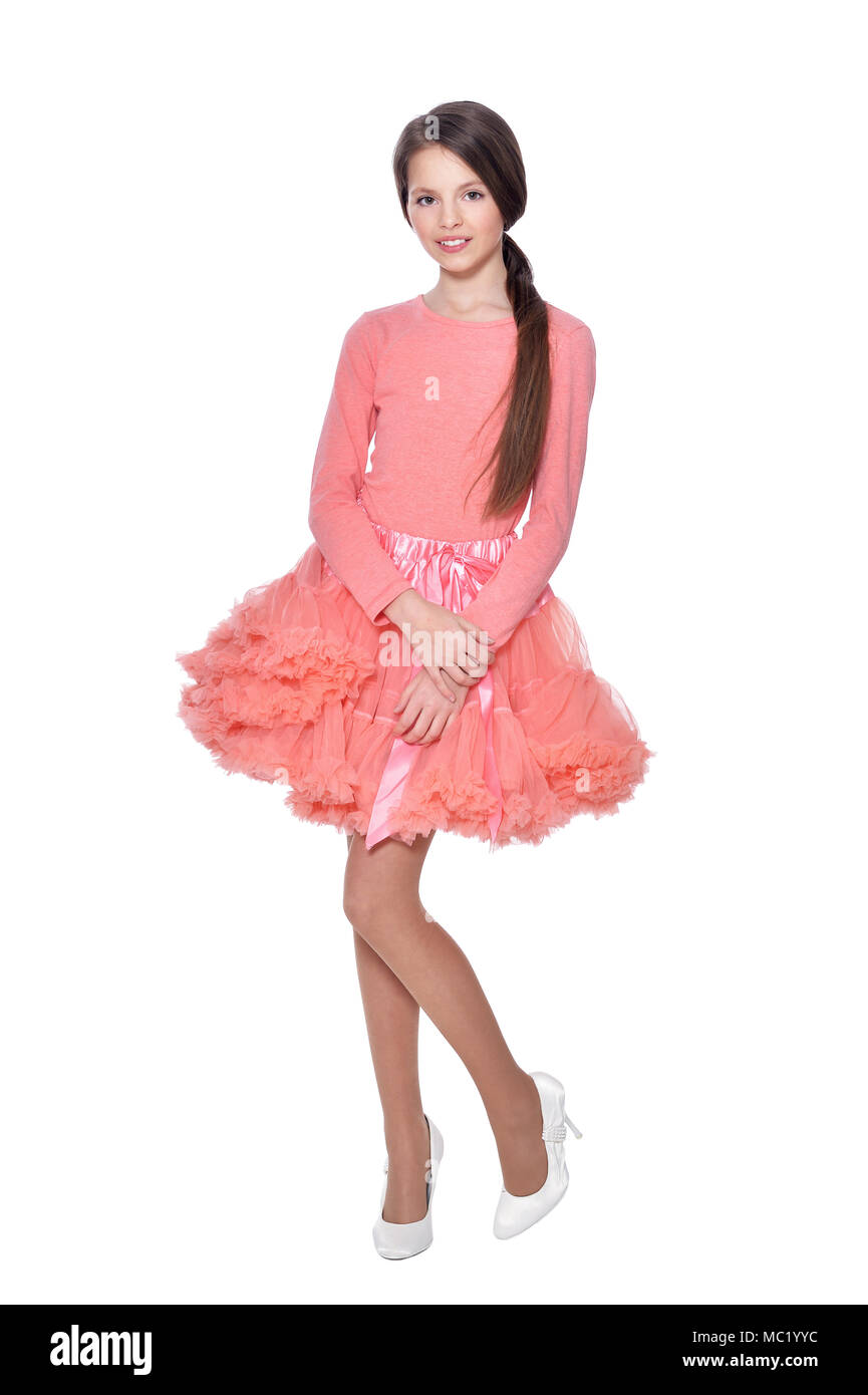 Happy little girl in pink dress posing isolated Stock Photo - Alamy