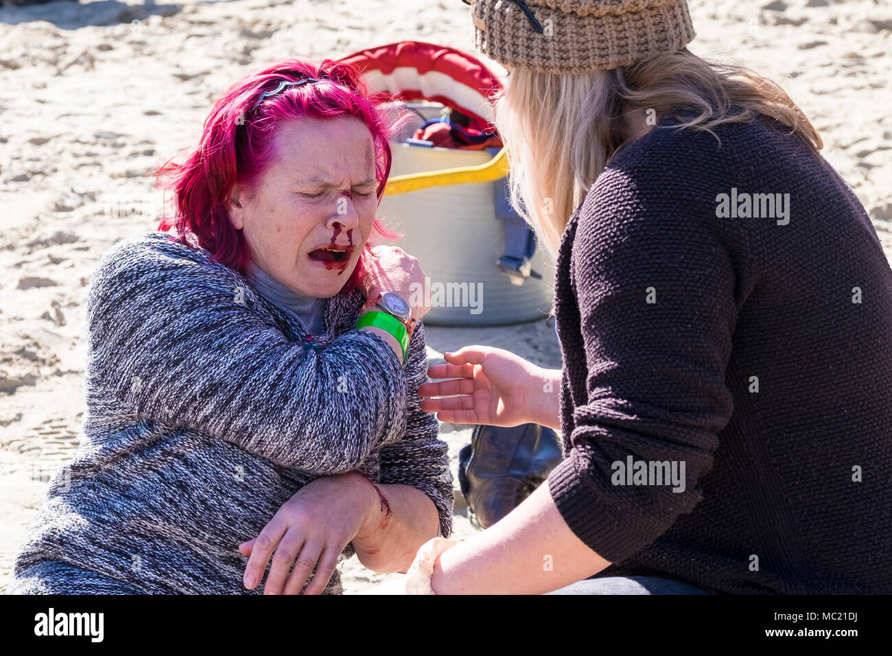 A volunteer with simulated injuries participating in a GMICE (Good Medicine in Challenging Environments) major incident exercise in Newquay Harbour. Stock Photo