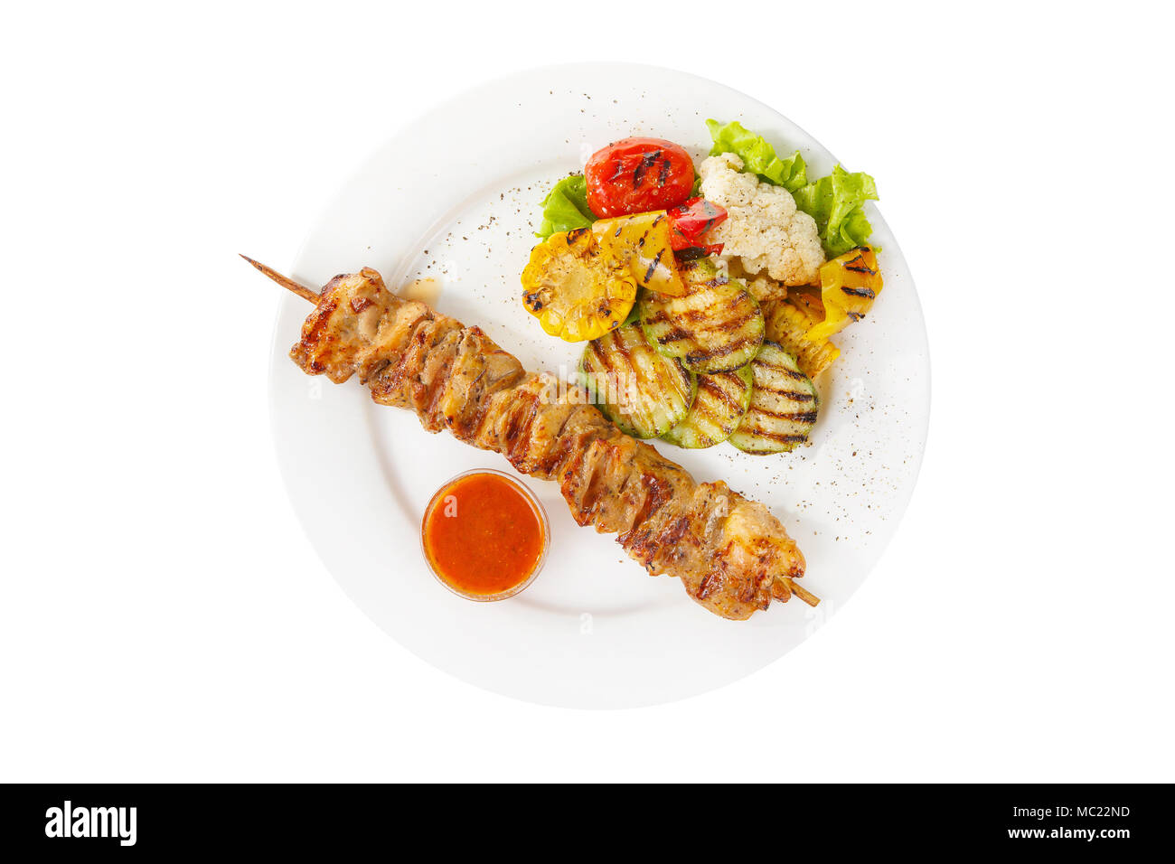 Shish kebab, beef, lamb, pork, chicken grilled meat, barbecue, with side dish vegetables, isolated on white background. Ketchup, tomato, red sauce. Vi Stock Photo