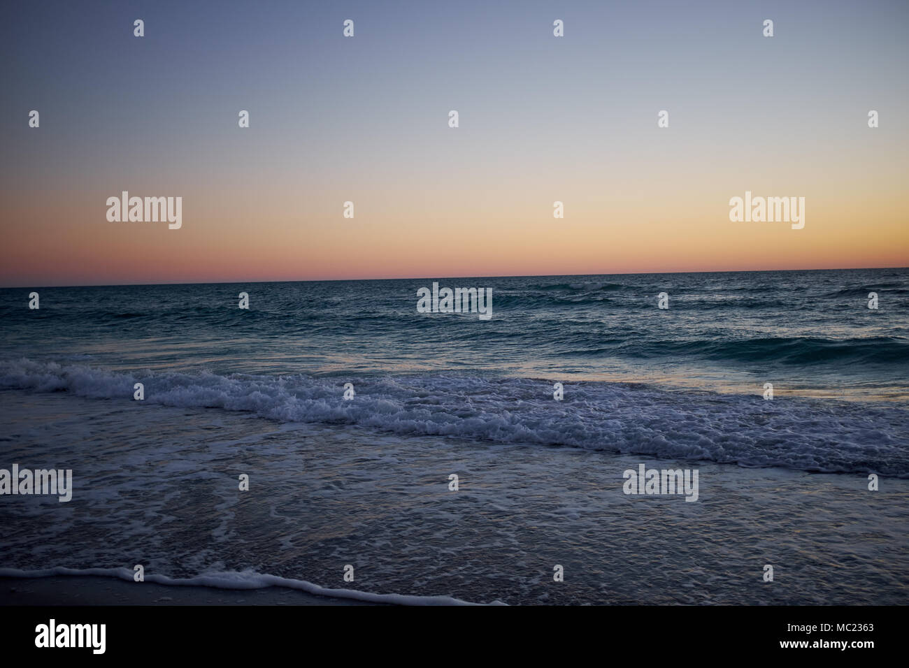 Gentle waves lap the beach hi-res stock photography and images - Alamy