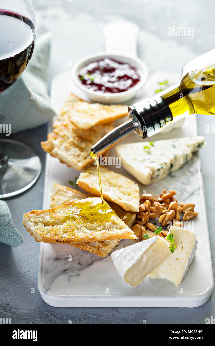 Small cheeseboard with baguette Stock Photo