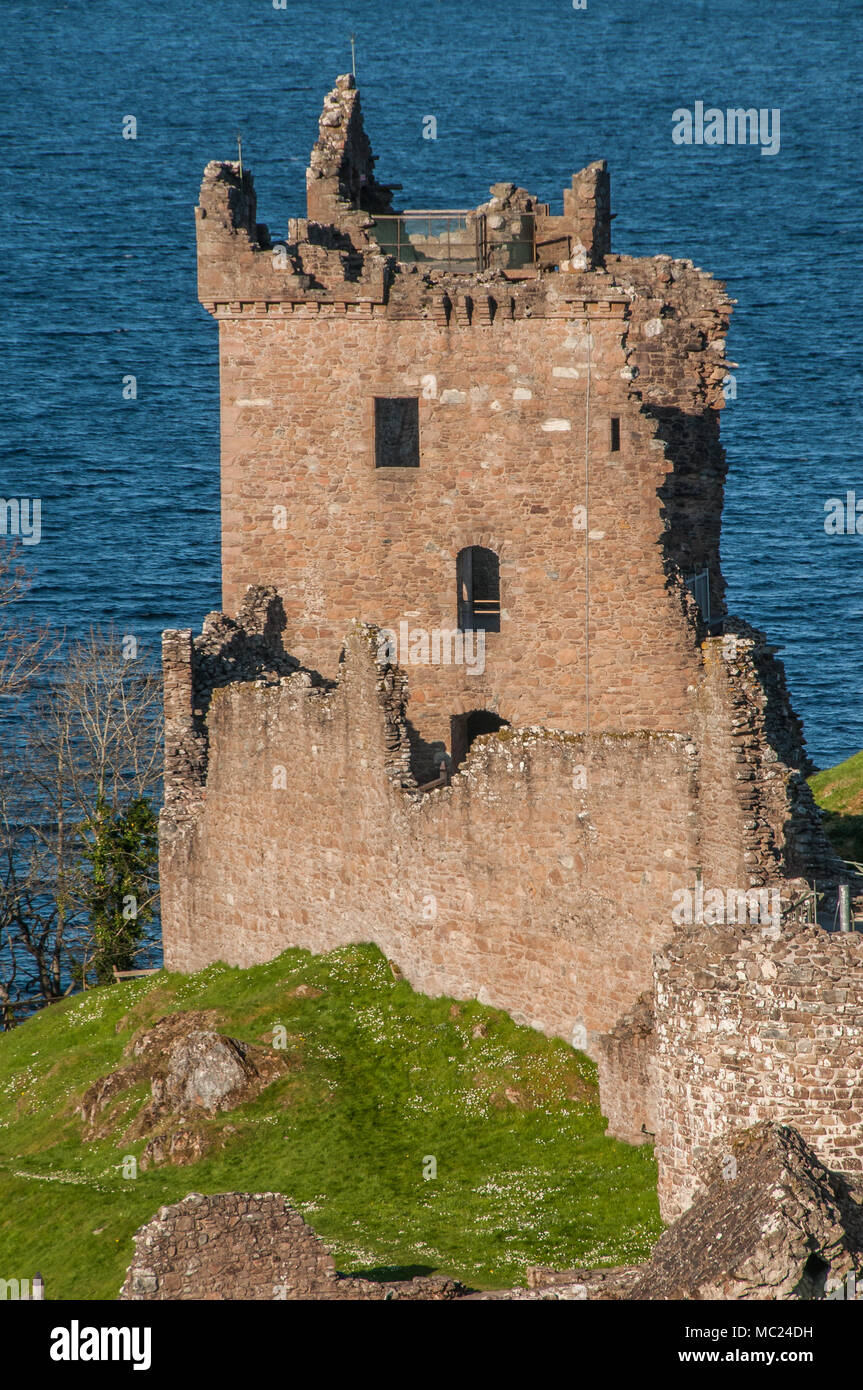 Urquhart Castle sits beside Loch Ness in the Highlands of Scotland overlooking the Urquhart Bay on the Loch. Stock Photo