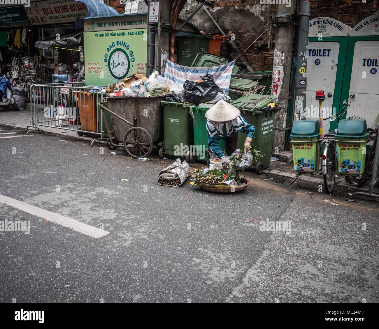 Everyday life street scene of adult wearing traditional Vietnamese ...