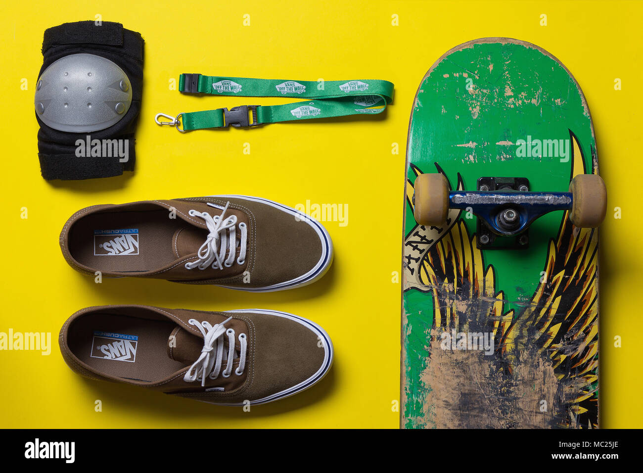 skateboard and skate gear against a bright background, top view Stock