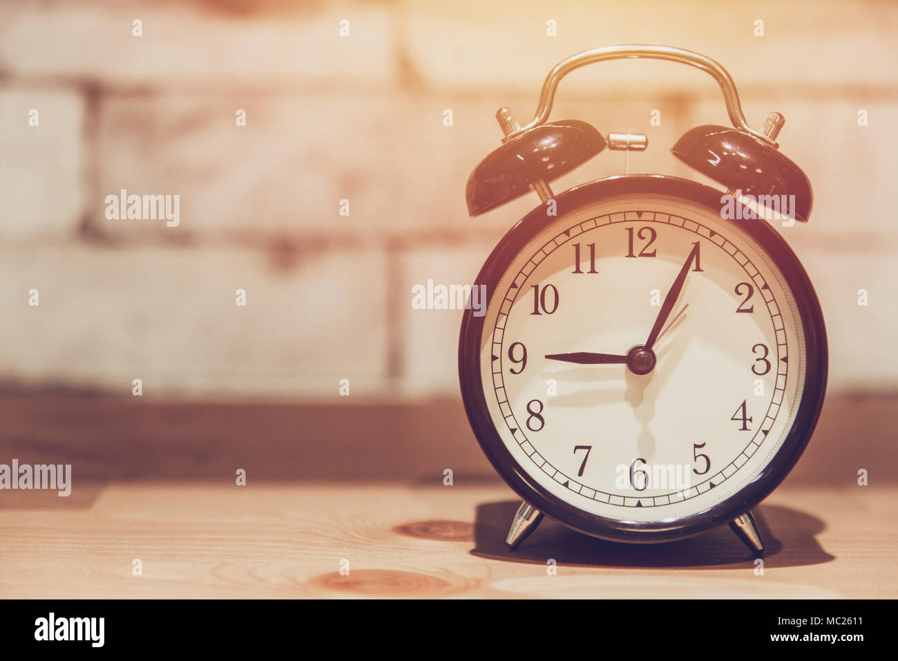 Vintage alarm clock decoration on wooden table with copy space Stock ...