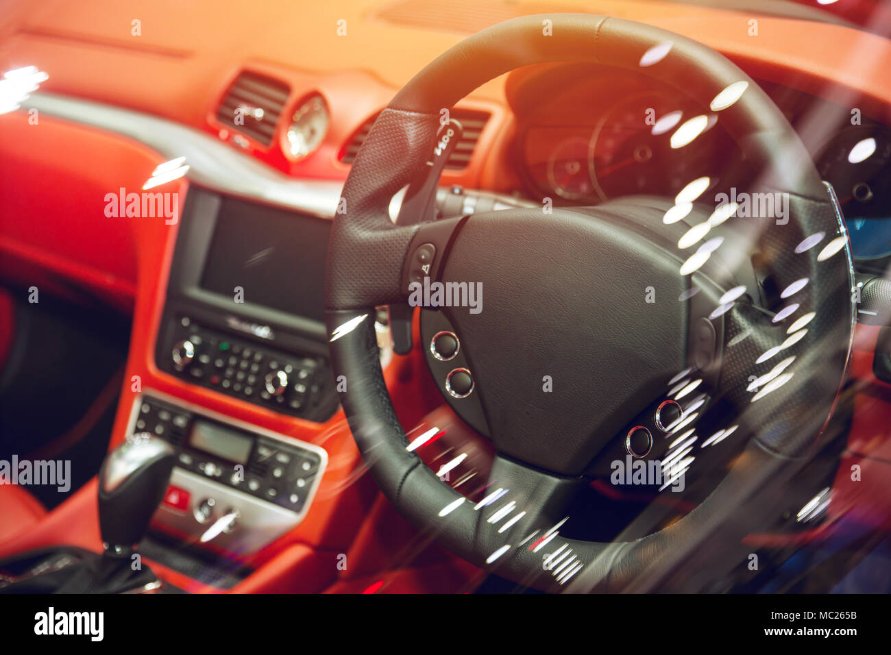 Luxury vehicle interior car dashboard with steering wheel made from leather Stock Photo