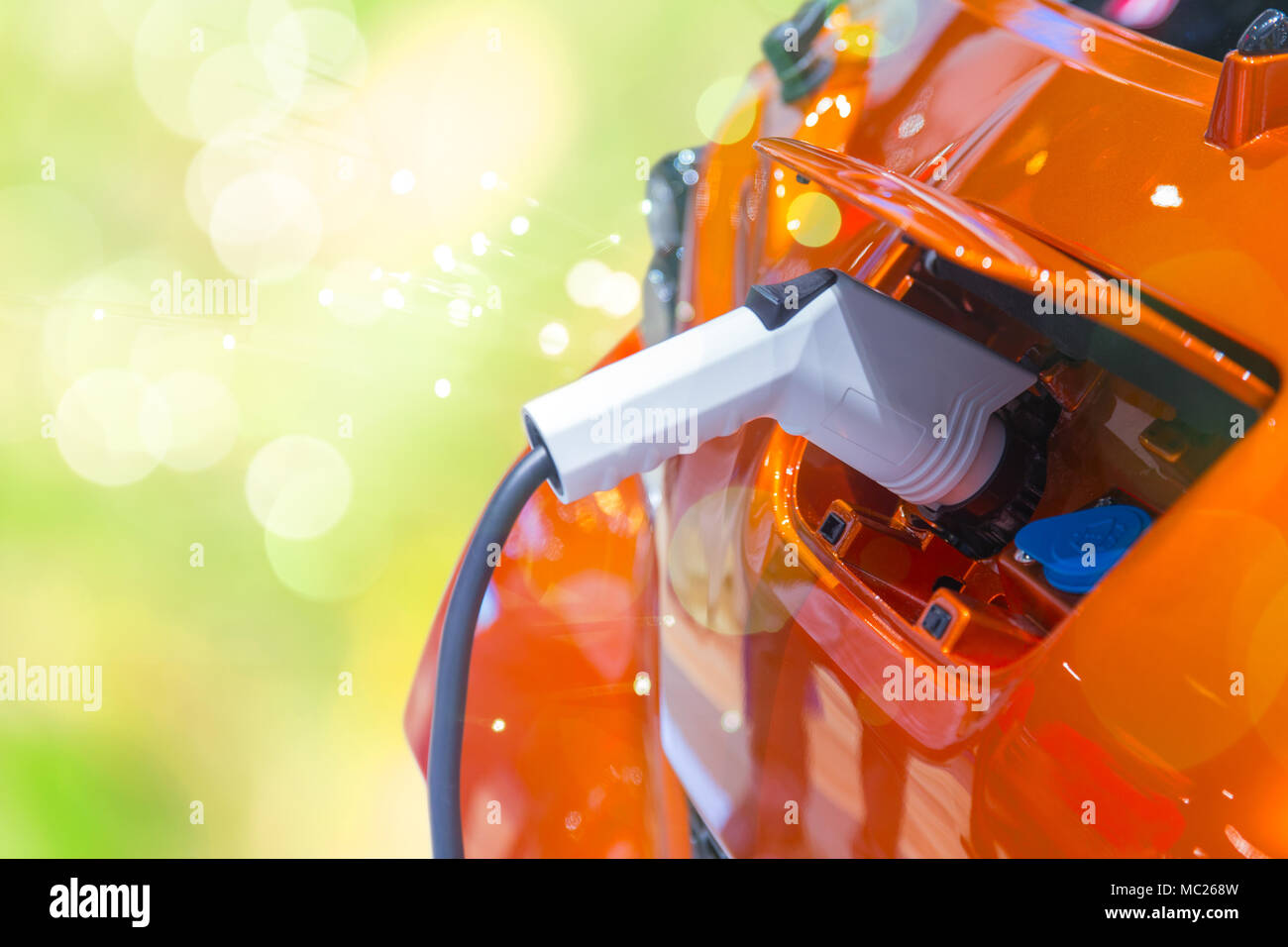 Green power EV Car or Electric car battery charging  Eco friendly vehicle energy concept Stock Photo