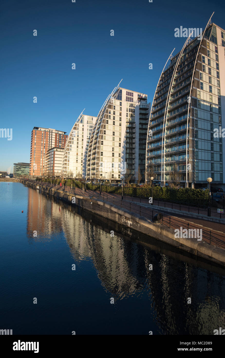 Early morning reflections at the NV Apartment Buildings in Salford Quays, Greater Manchester England UK Stock Photo