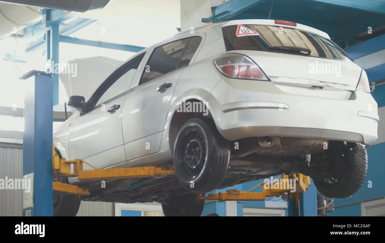 Mechanic lifting hood of car hi-res stock photography and images - Alamy