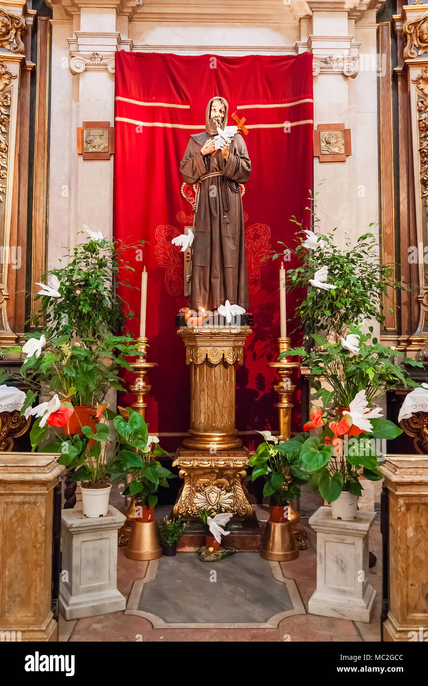 Saint Francis of Assisi statue sculpture with doves/cross. Santo Antonio de Lisboa Church. Saint Anthony of Lisbon (Padua/Padova) birthplace. Portugal Stock Photo