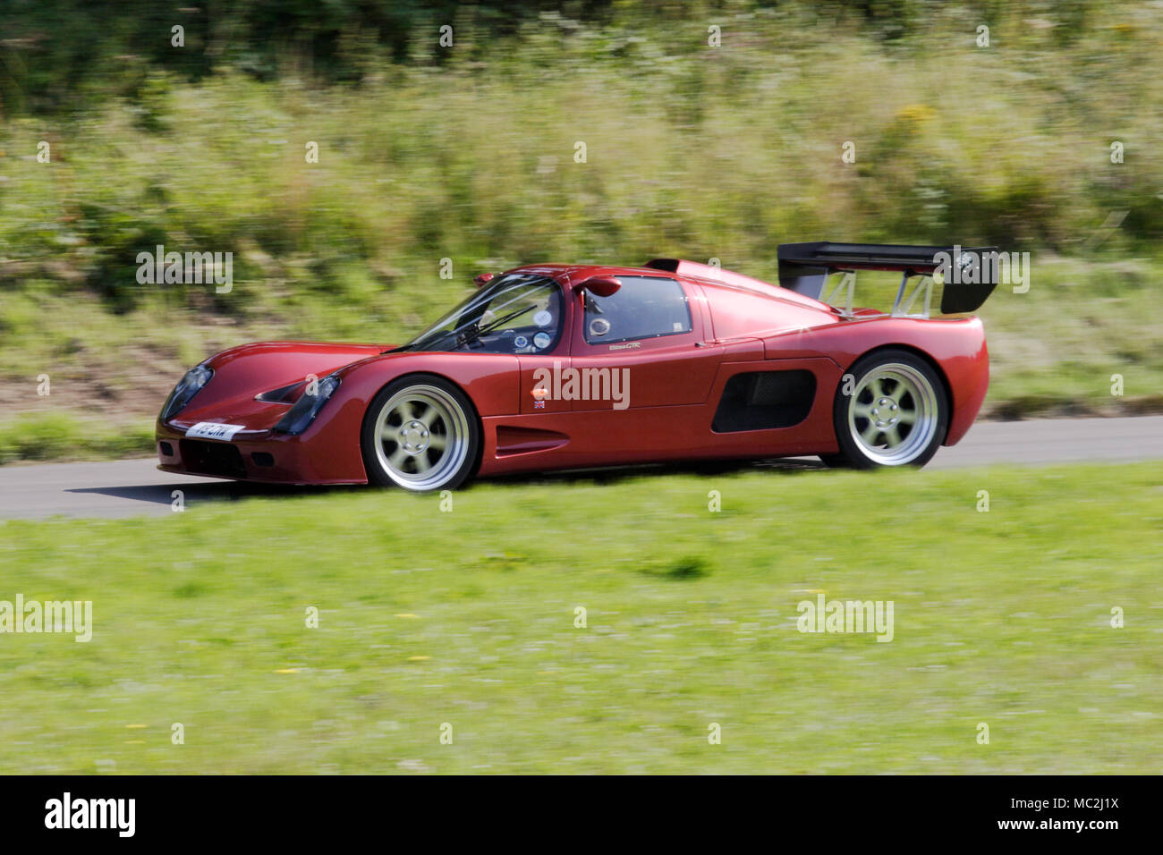 Ultima GTR road legal track racing car driving fast on a country road. Stock Photo