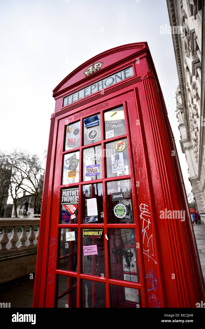Traditional British Red Phone Box on Pavement - Westminster Square - London UK Stock Photo