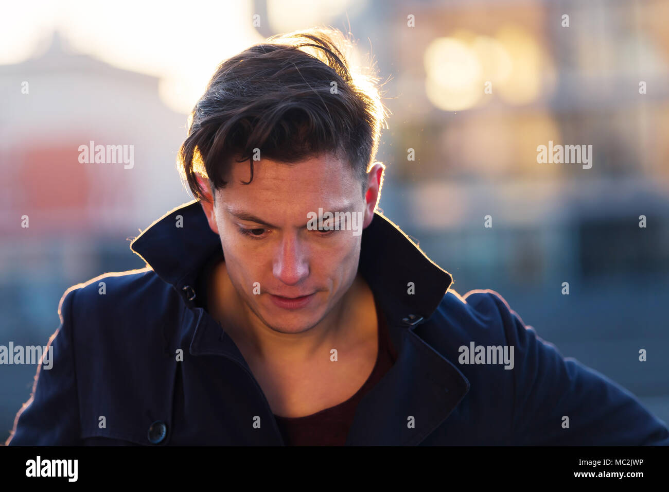 portrait of a young man in urban surrounding Stock Photo - Alamy