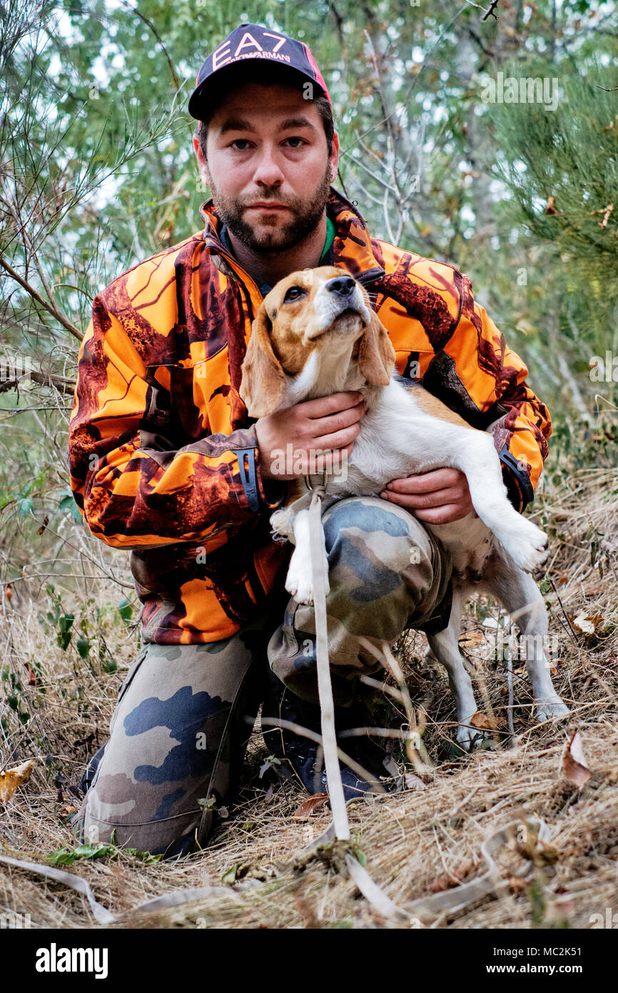 A wild boar hunter with his trainee tracker dog in the Ardeche south central France. Stock Photo